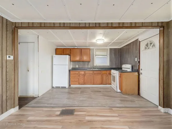 a view of a kitchen with a sink and cabinets