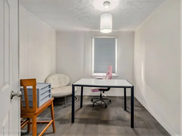 a view of a workspace with furniture