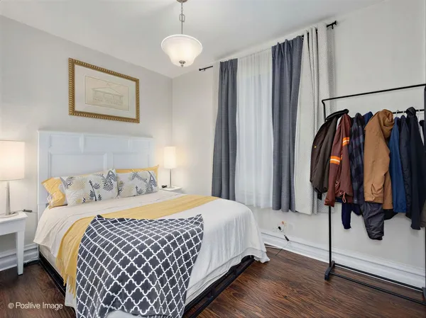 a bedroom with a bed and a mirror