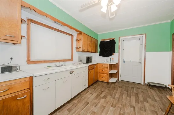 a kitchen with a sink stove and refrigerator