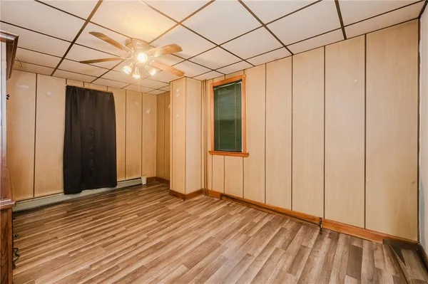 a view of a room with wooden floor