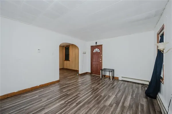 a view of a room with wooden floor and stairs