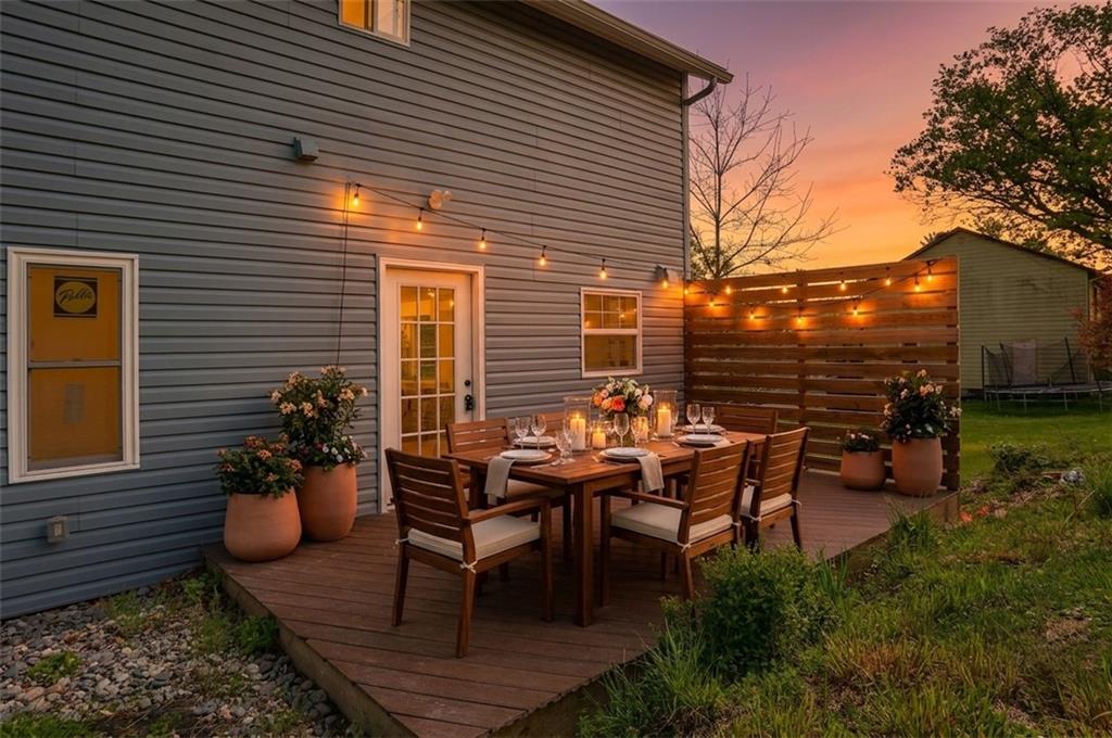 2513 Grove Road South Park, PA 15129 - Photo 38 of 50 a view of a patio with table and chairs and wooden fence