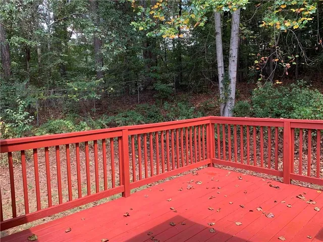 a view of balcony with wooden fence