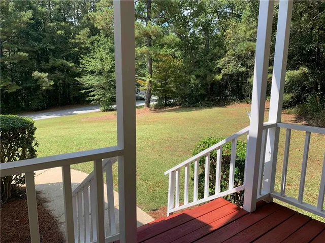 a view of balcony with yard