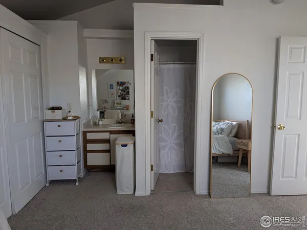a couple of table and chair in front of a door