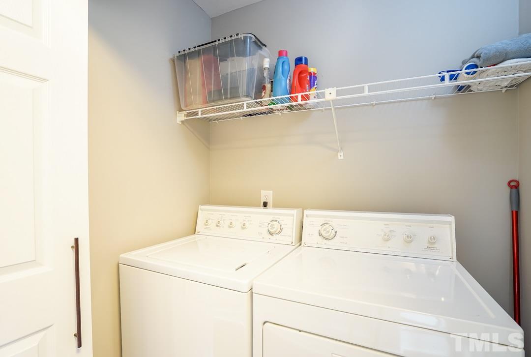 1318 Springlawn Court Raleigh, NC 27609 - Photo 12 of 30 a utility room with dryer and washer