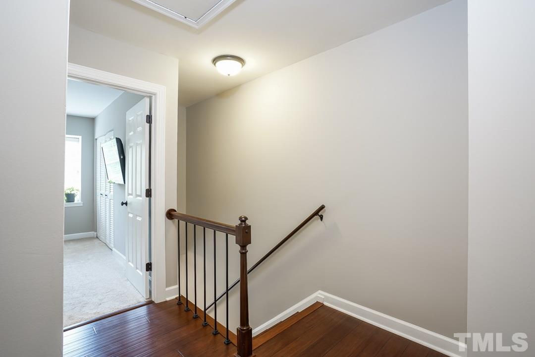 1318 Springlawn Court Raleigh, NC 27609 - Photo 14 of 30 a view of a hallway with wooden floor
