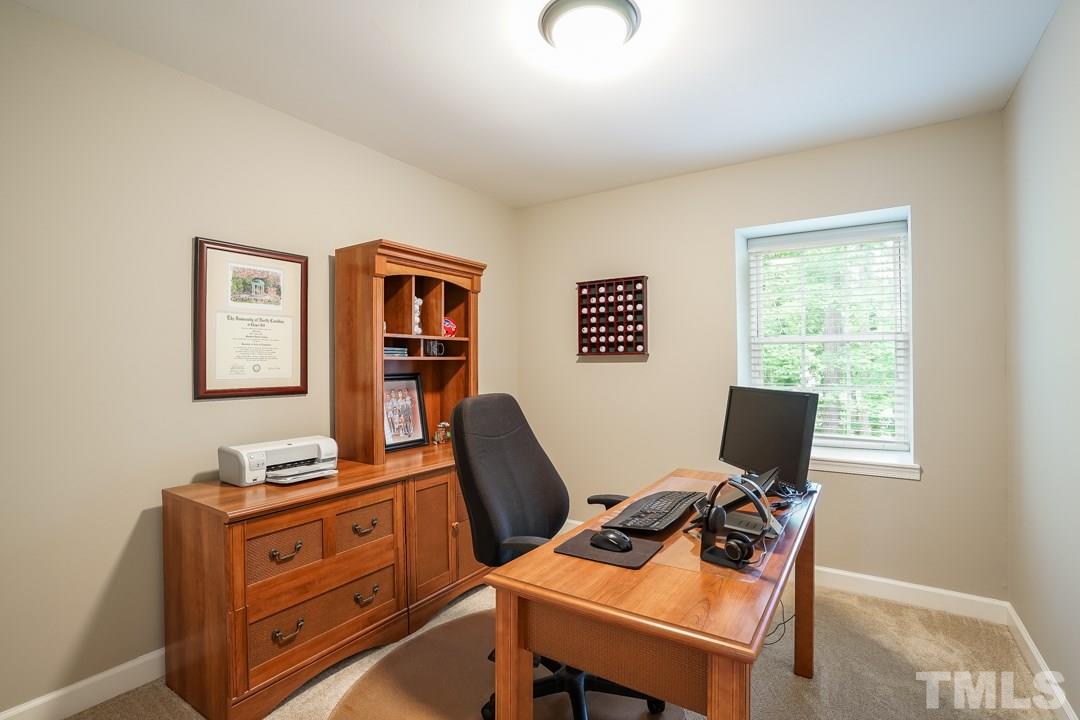 1318 Springlawn Court Raleigh, NC 27609 - Photo 20 of 30 a view of a workspace with furniture and a window