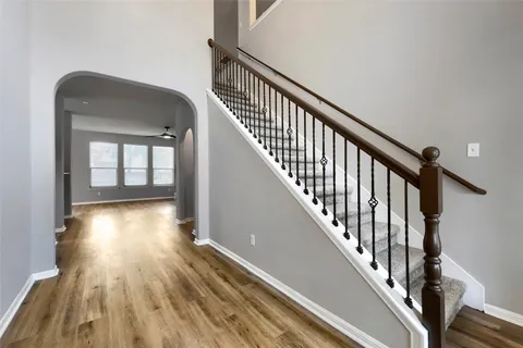 a view of gallery with wooden floor
