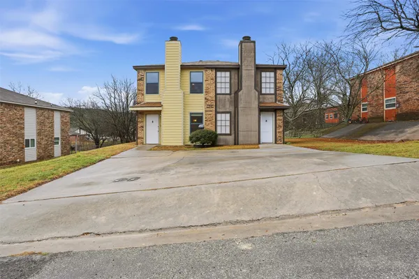 a view of a building with a street