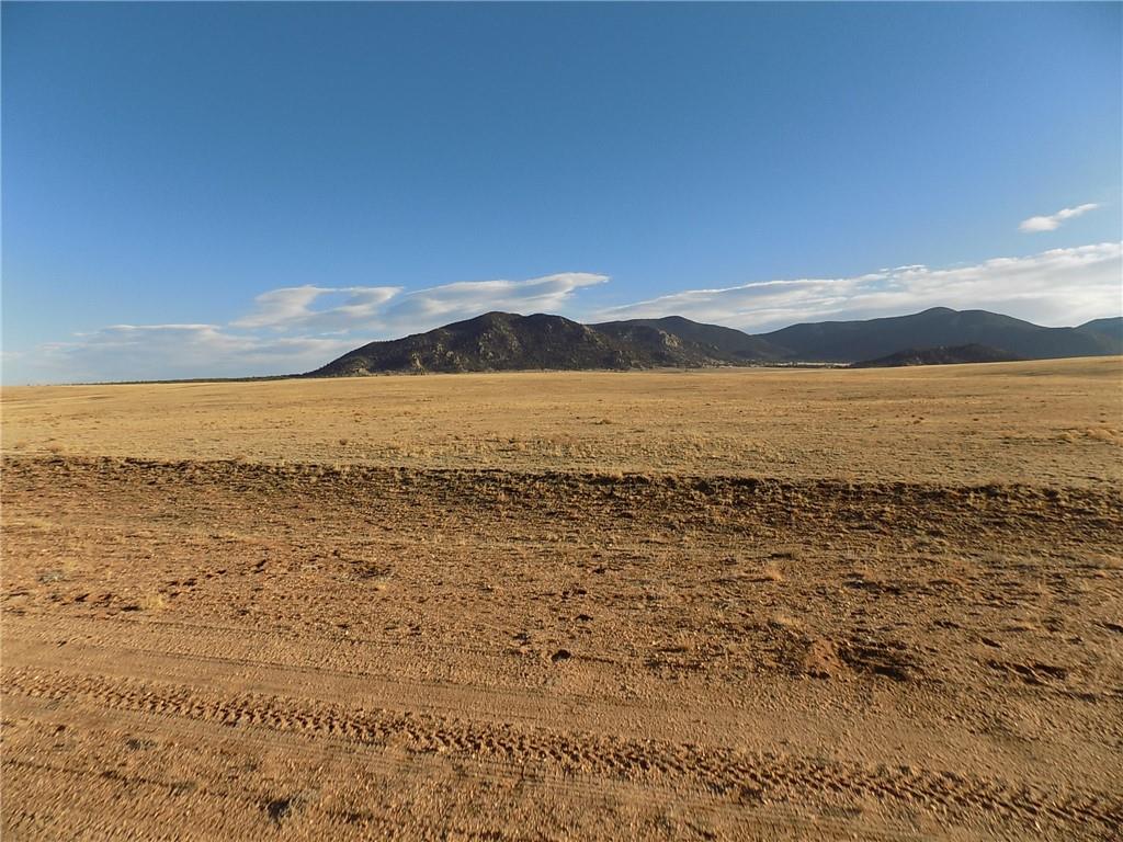 85 East Chase Road Hartsel, CO 80449 - Photo 3 of 12 a view of an ocean beach and mountain