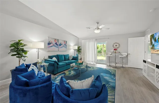 a living room with furniture and a large window