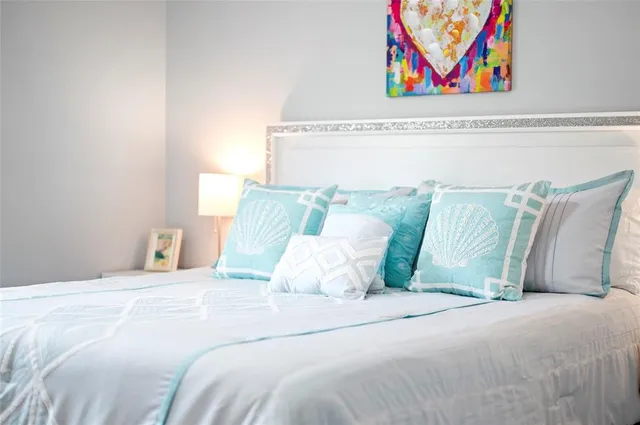 a bathroom with a toilet sink double vanity and mirror