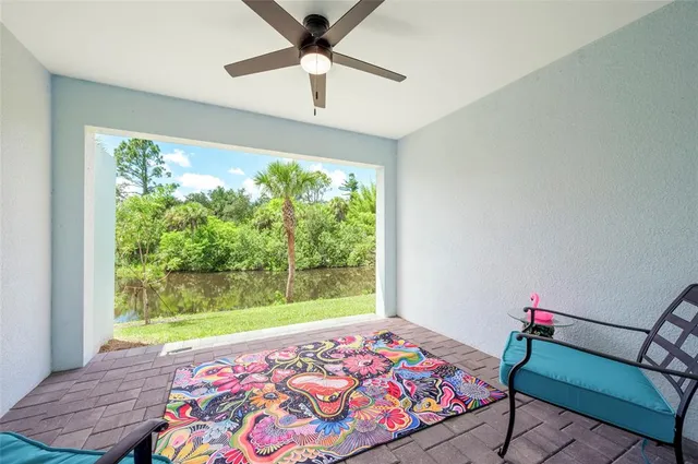 an aerial view of residential house with outdoor space and trees all around