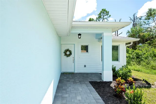 a view of a house with a potted plant