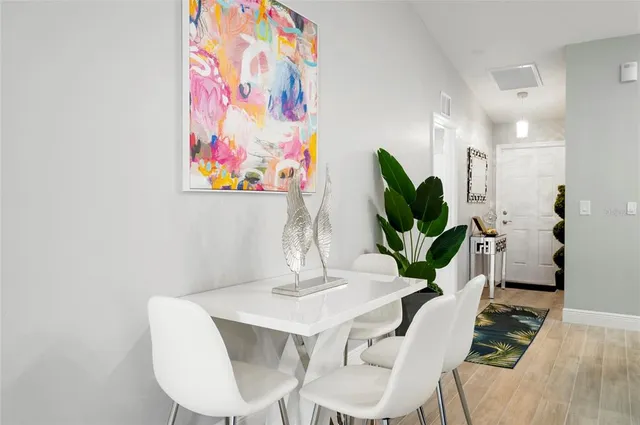 a living room with furniture flowerpot and a potted plant