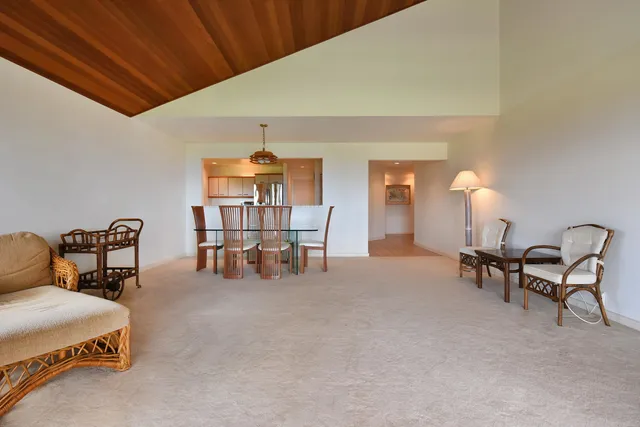 a bedroom with furniture and a lamp