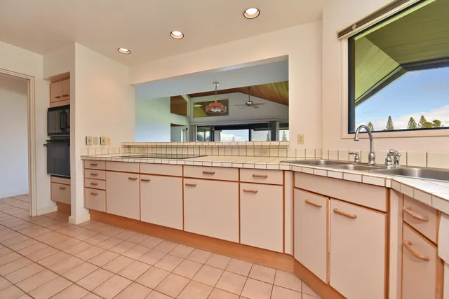 a kitchen with cabinets and sink