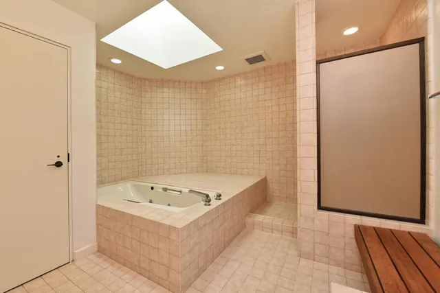a bathroom with a bathtub and shower