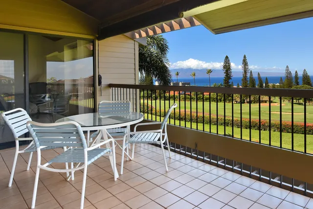 a view of a chairs and table in patio