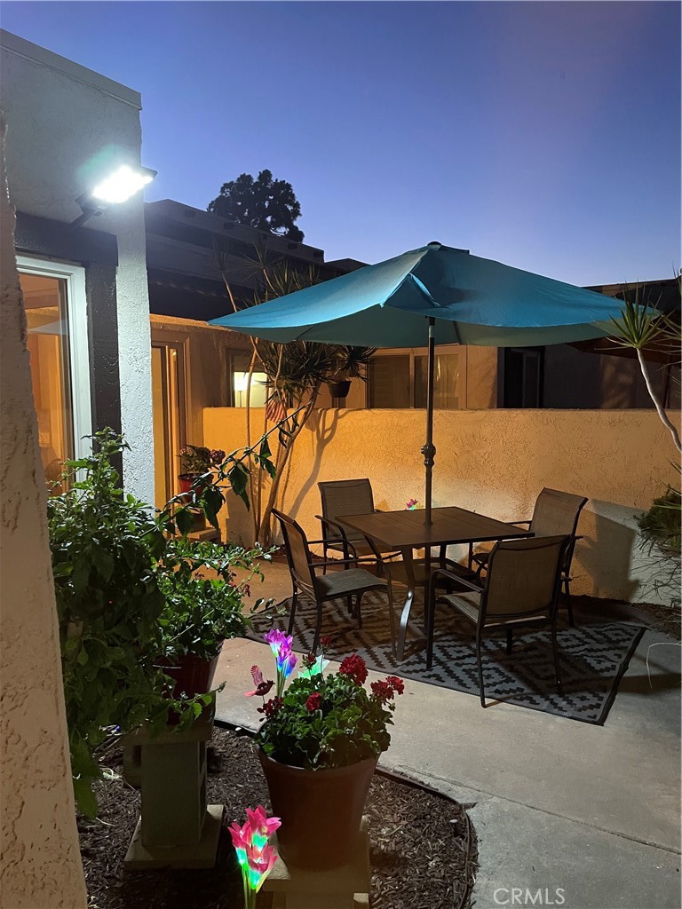 9866 Lido Way, Unit 20 Cypress, CA 90630 - Photo 16 of 24 a view of a chairs and table in the patio