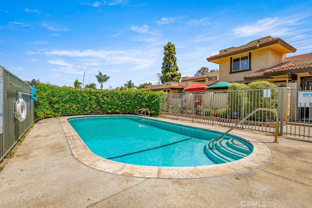 9866 Lido Way, Unit 20 Cypress, CA 90630 - Photo 19 of 24 a view of a swimming pool with a patio