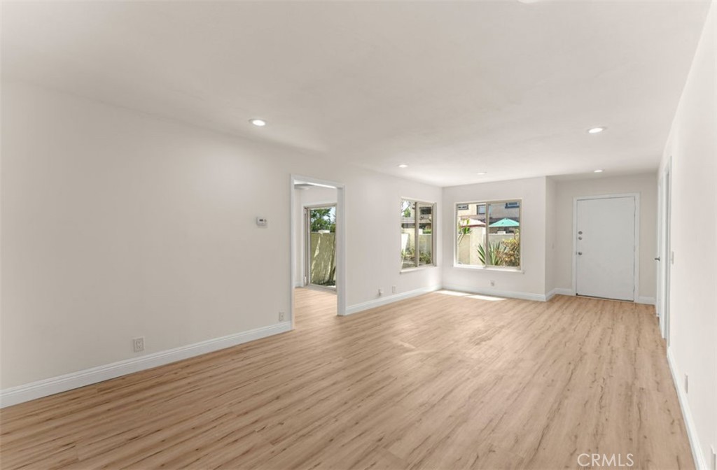 9866 Lido Way, Unit 20 Cypress, CA 90630 - Photo 3 of 24 a view of empty room with wooden floor and window