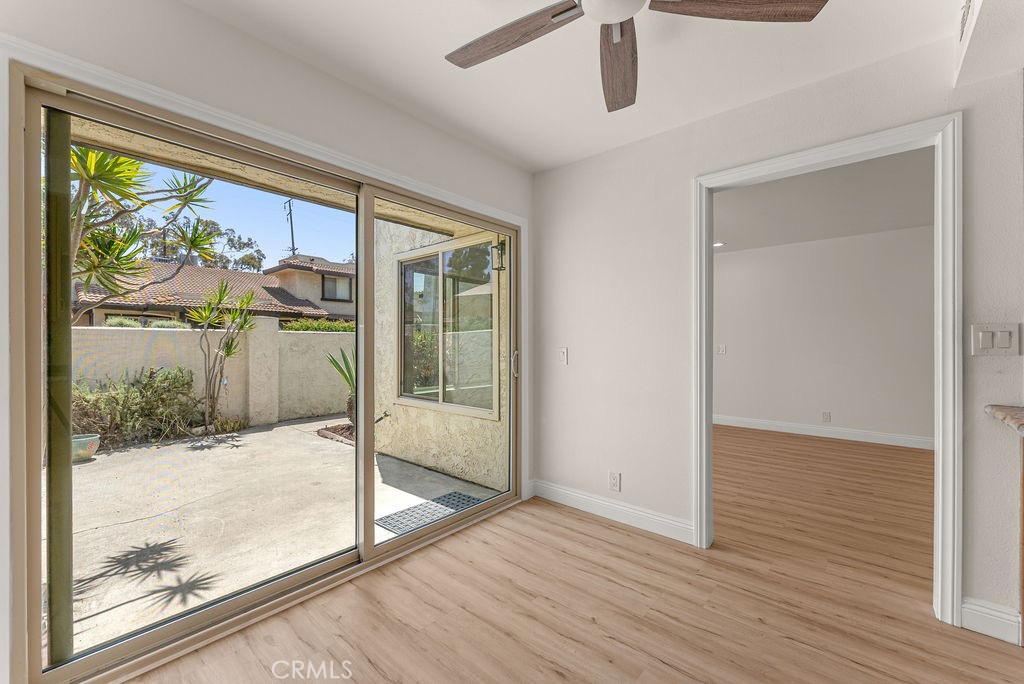 9866 Lido Way, Unit 20 Cypress, CA 90630 - Photo 6 of 24 a view of a room with wooden floor and door