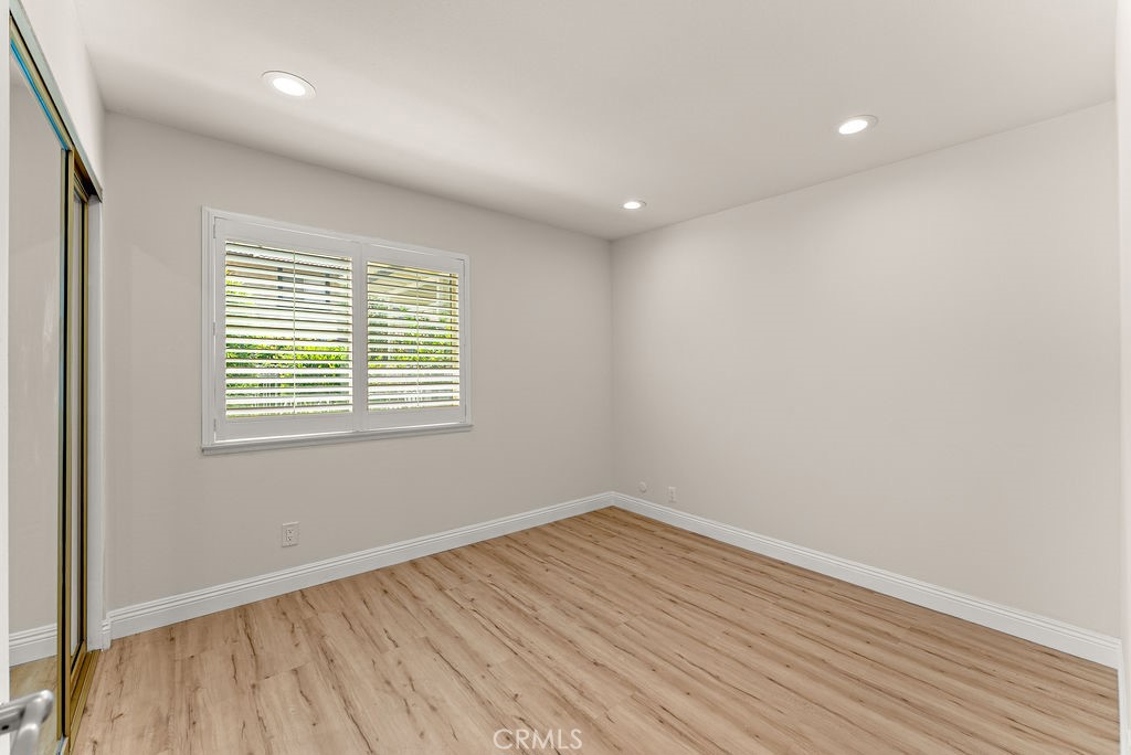 9866 Lido Way, Unit 20 Cypress, CA 90630 - Photo 7 of 24 wooden floor in an empty room with a window