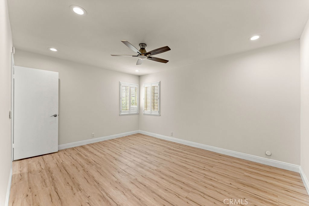 9866 Lido Way, Unit 20 Cypress, CA 90630 - Photo 8 of 24 wooden floor in an empty room with a window