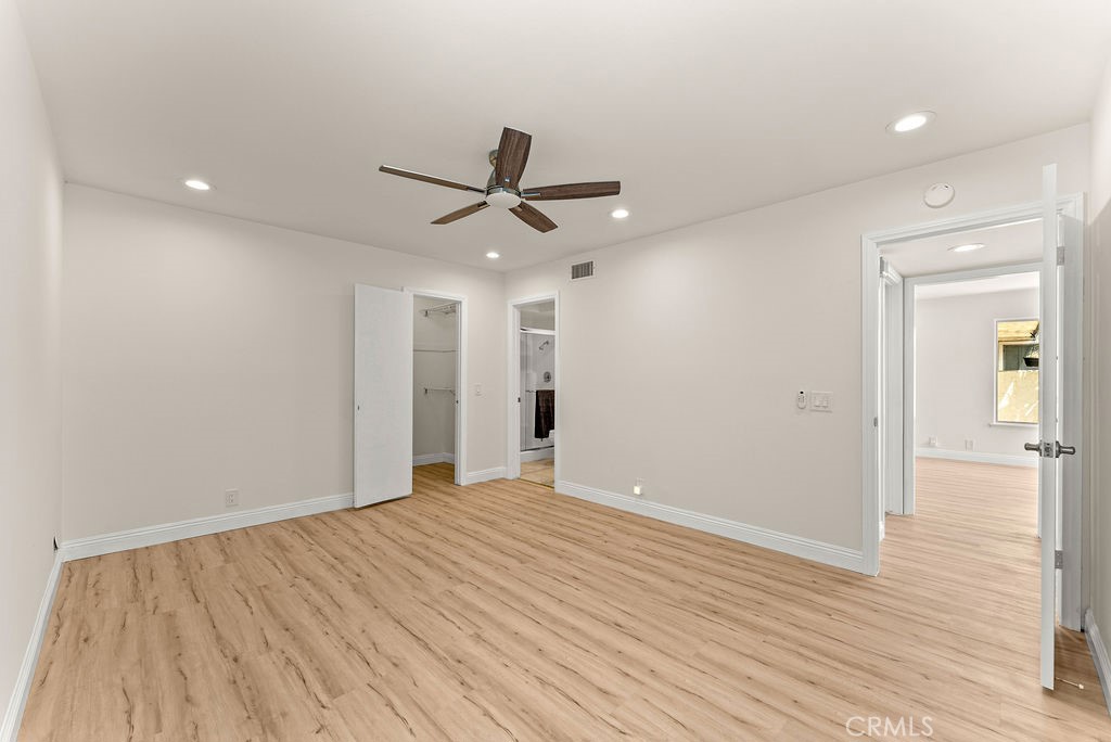 9866 Lido Way, Unit 20 Cypress, CA 90630 - Photo 9 of 24 wooden floor in an empty room with a window