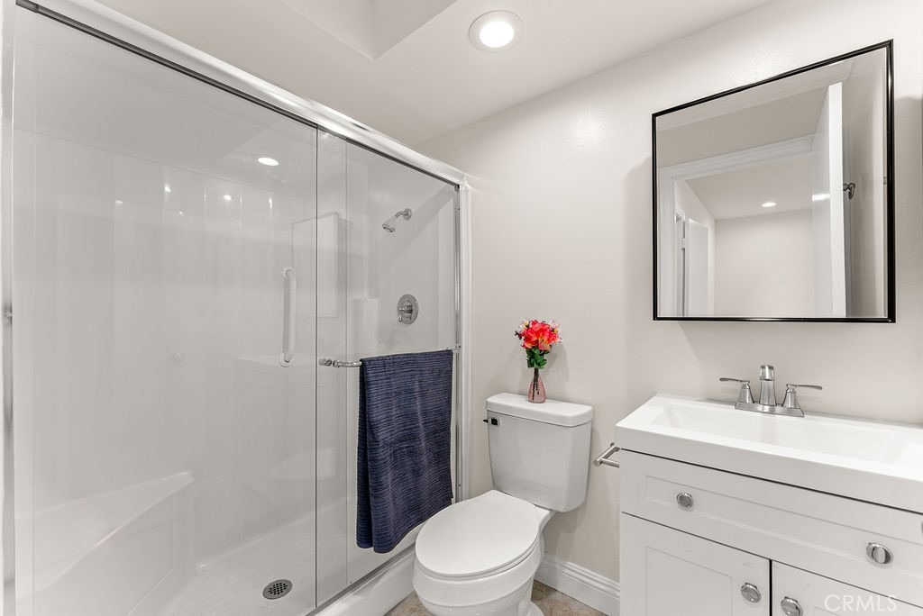 9866 Lido Way, Unit 20 Cypress, CA 90630 - Photo 10 of 24 a bathroom with a sink toilet and shower