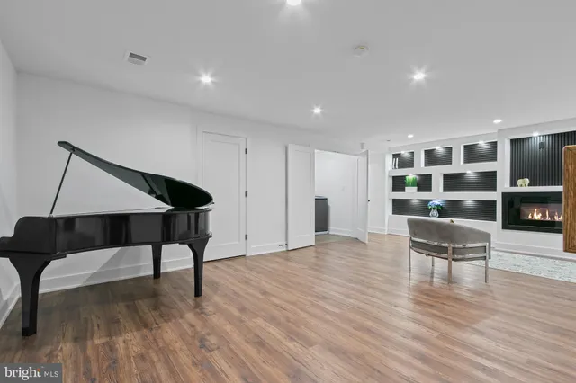 a view of a living room and kitchen with a large window