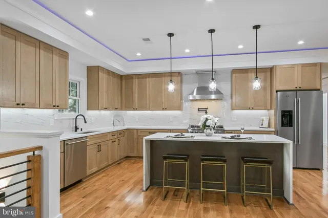 a bathroom with a glass shower door and a sink