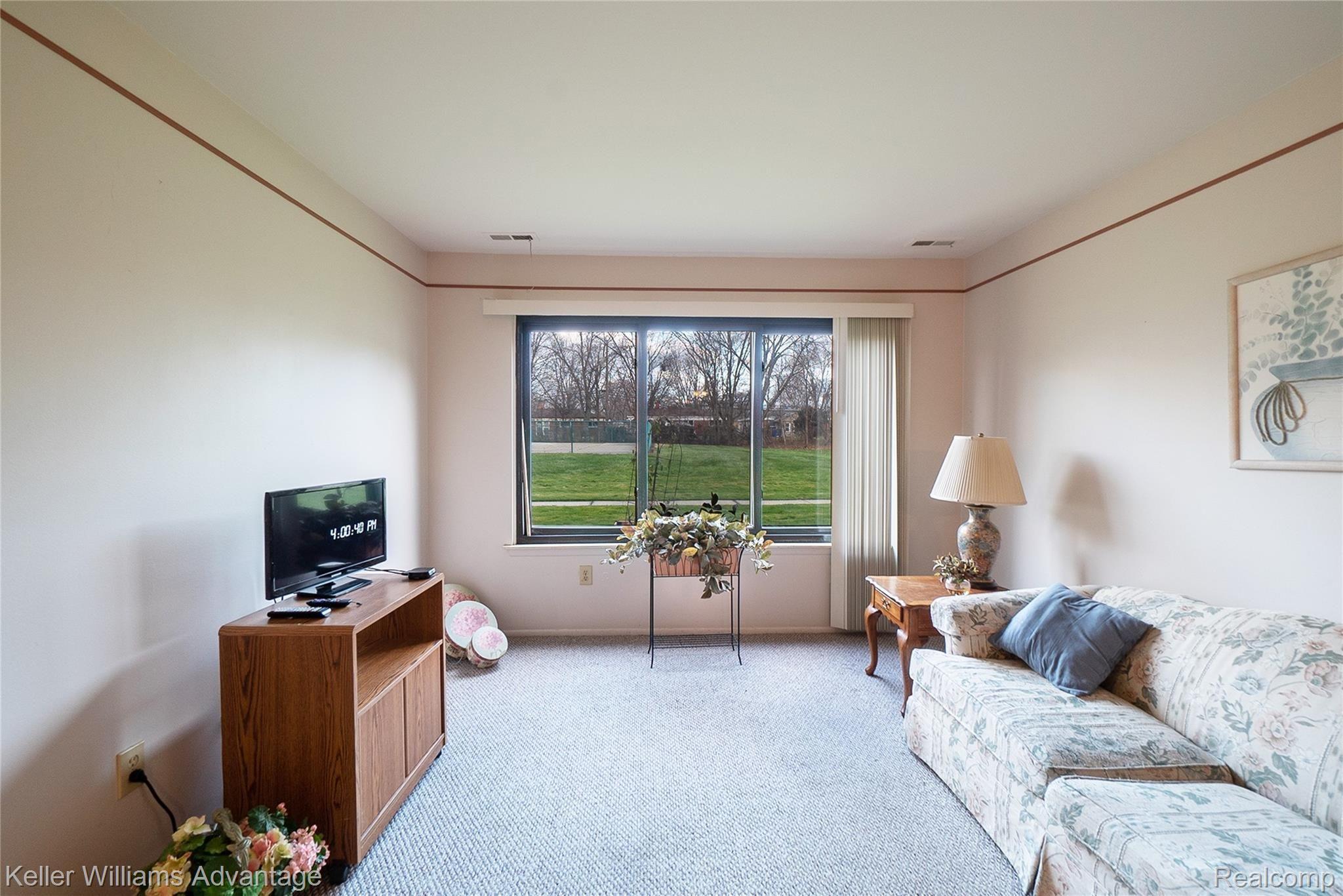 4949 East 10 Mile Road, Unit 104 Warren, MI 48091 - Photo 2 of 16 W10MileRd_4949_Livingroom 1.jpg