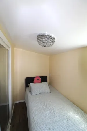 a bedroom with a bed and a table
