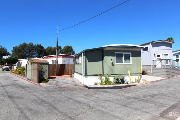 a view of a terrace with a table and chairs