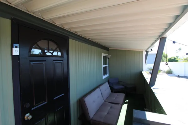 a living room with furniture and a window