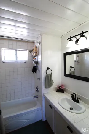 a bathroom with a sink and a bathtub