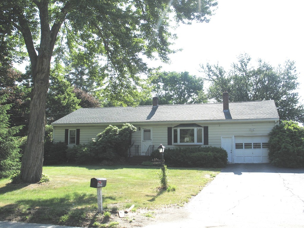 409 Lake Street Haverhill, MA 01832 - Photo 1 of 25 a front view of a house with a yard