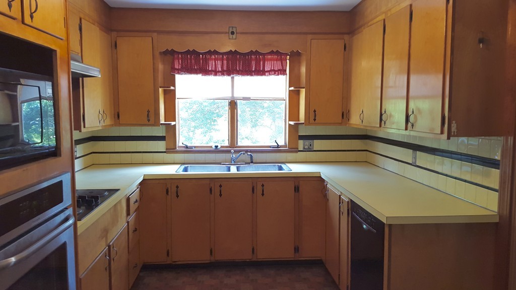 409 Lake Street Haverhill, MA 01832 - Photo 12 of 25 a kitchen with a sink and a window