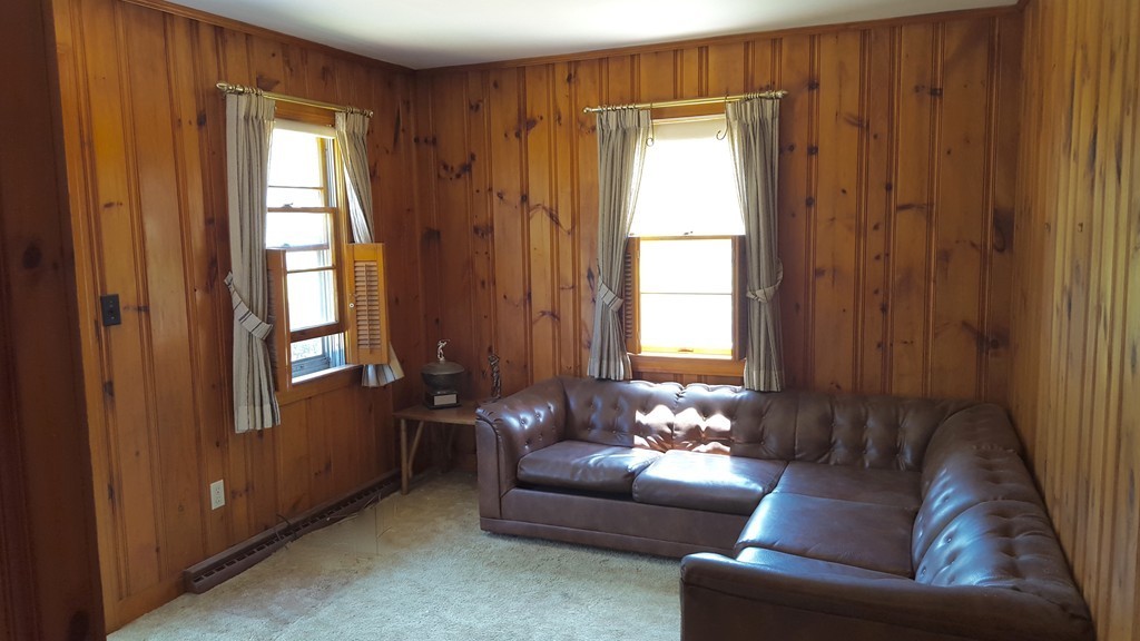 409 Lake Street Haverhill, MA 01832 - Photo 14 of 25 a living room with furniture and a window