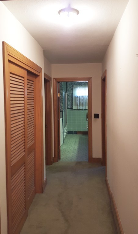 409 Lake Street Haverhill, MA 01832 - Photo 18 of 25 an empty room with closet and a window