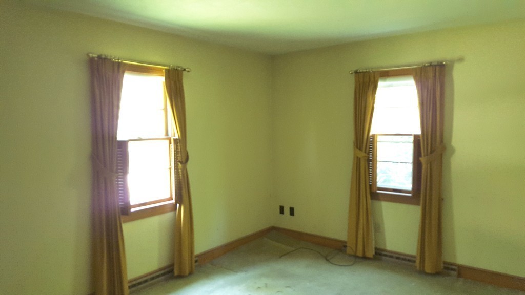 409 Lake Street Haverhill, MA 01832 - Photo 20 of 25 a view of an empty room with a window