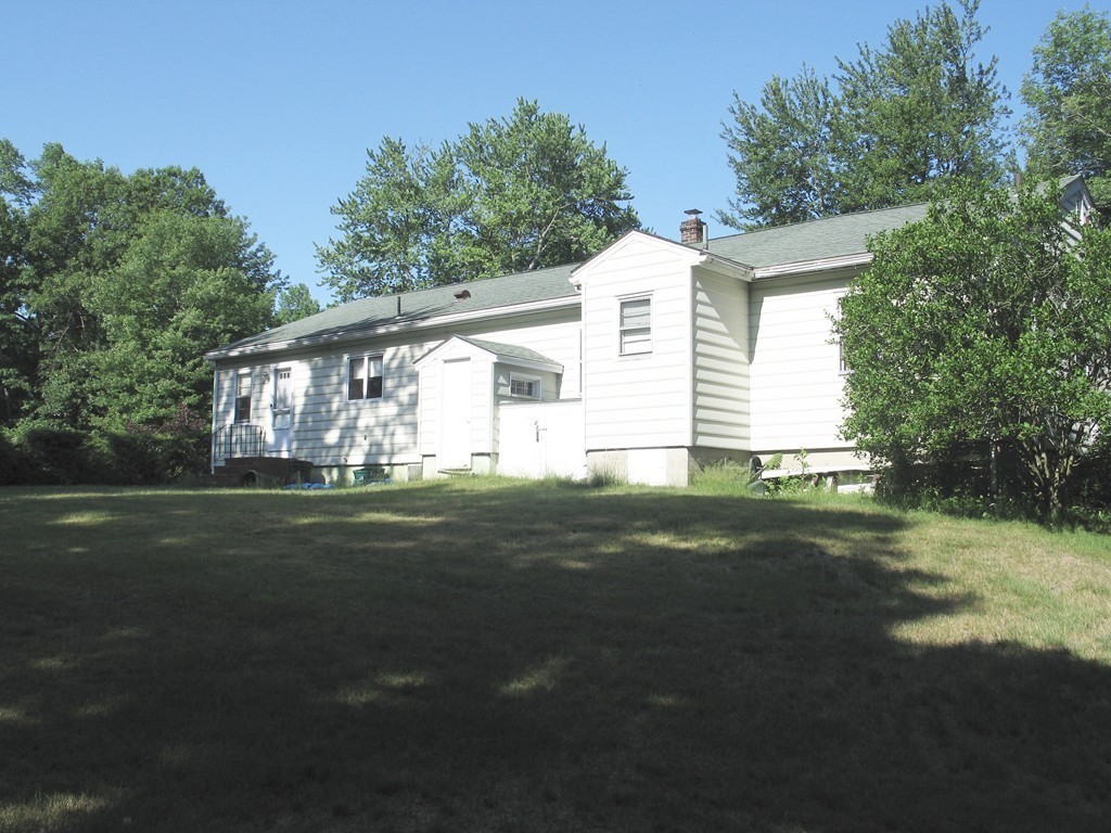 409 Lake Street Haverhill, MA 01832 - Photo 24 of 25 a front view of a house with garden