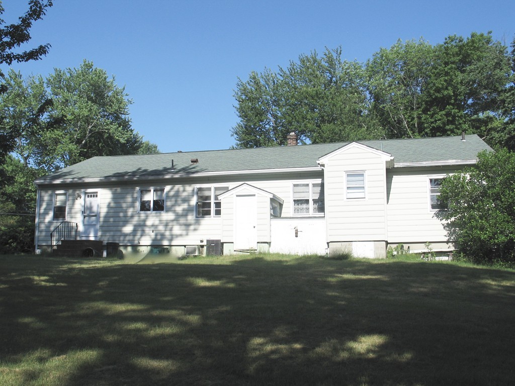 409 Lake Street Haverhill, MA 01832 - Photo 3 of 25 a front view of a house with a garden