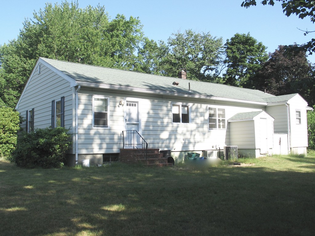 409 Lake Street Haverhill, MA 01832 - Photo 6 of 25 a front view of a house with a yard