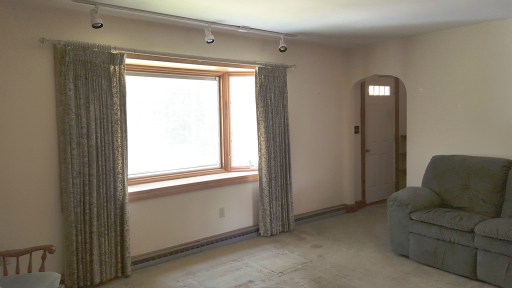 409 Lake Street Haverhill, MA 01832 - Photo 9 of 25 a living room with furniture and a window