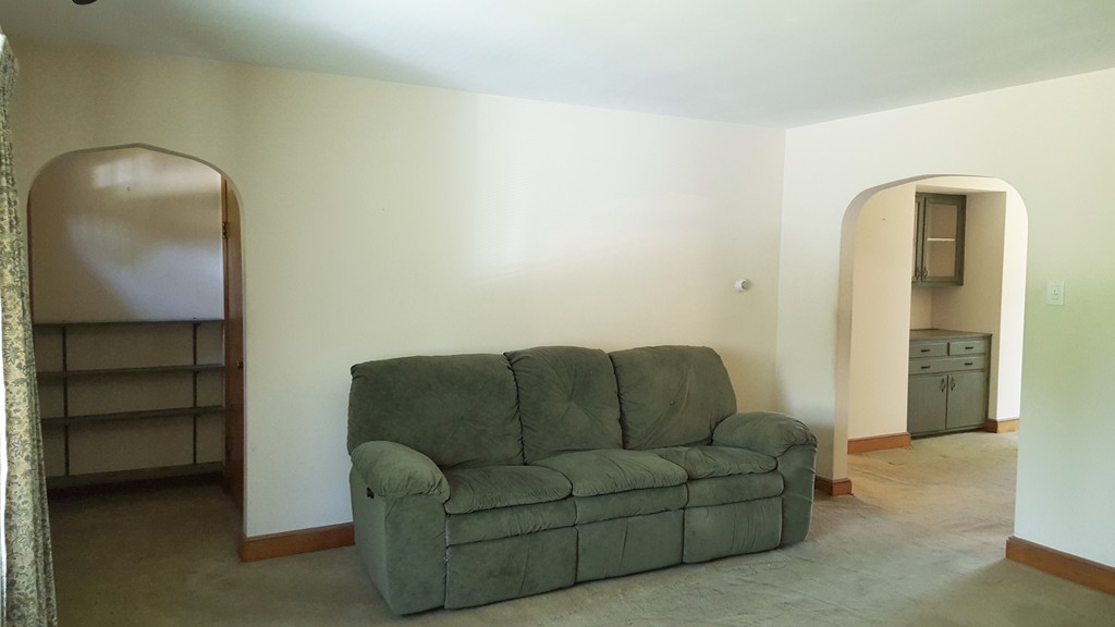 409 Lake Street Haverhill, MA 01832 - Photo 10 of 25 a living room with furniture and a walk in closet